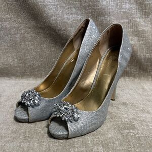 Badgley Mischka Belle silver glitter peep-toe pumps with a crystal embellishment